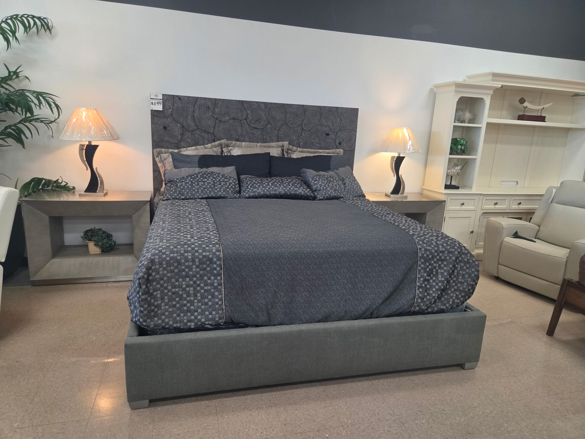 Gray upholstered bed with coordinated bedroom furniture