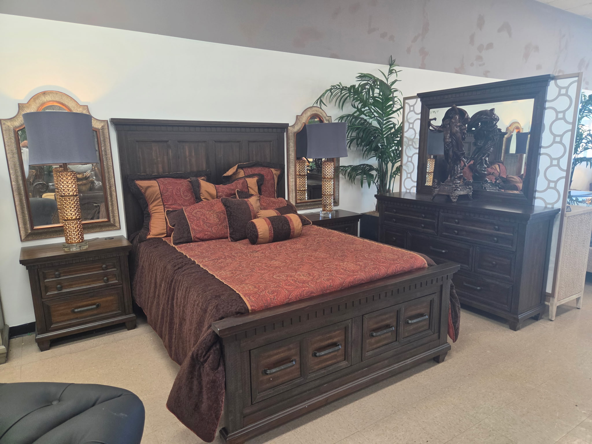 Traditional dark wood storage bed with matching dresser and mirror