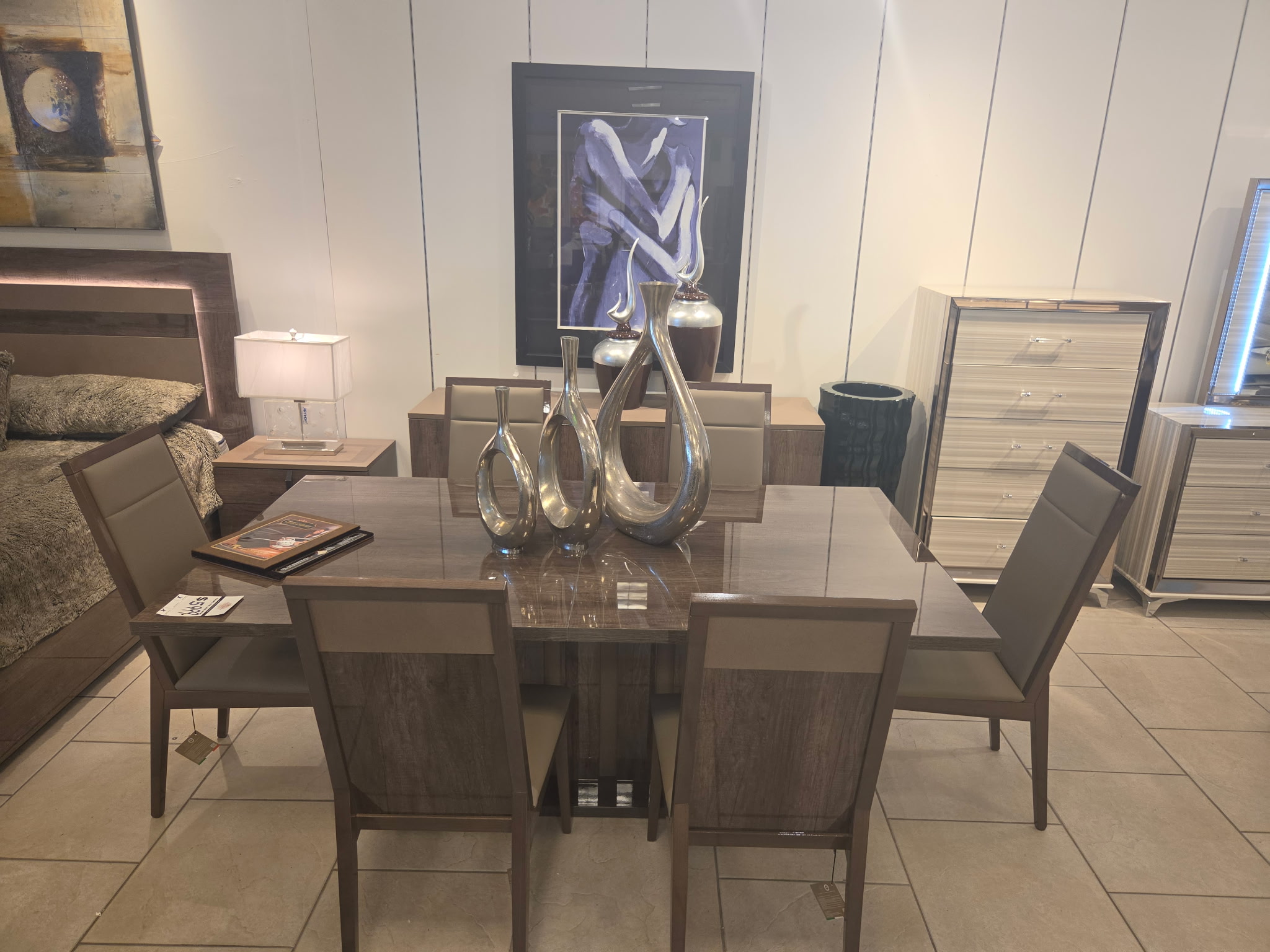 Wood dining table with upholstered chairs and coordinated bedroom furniture