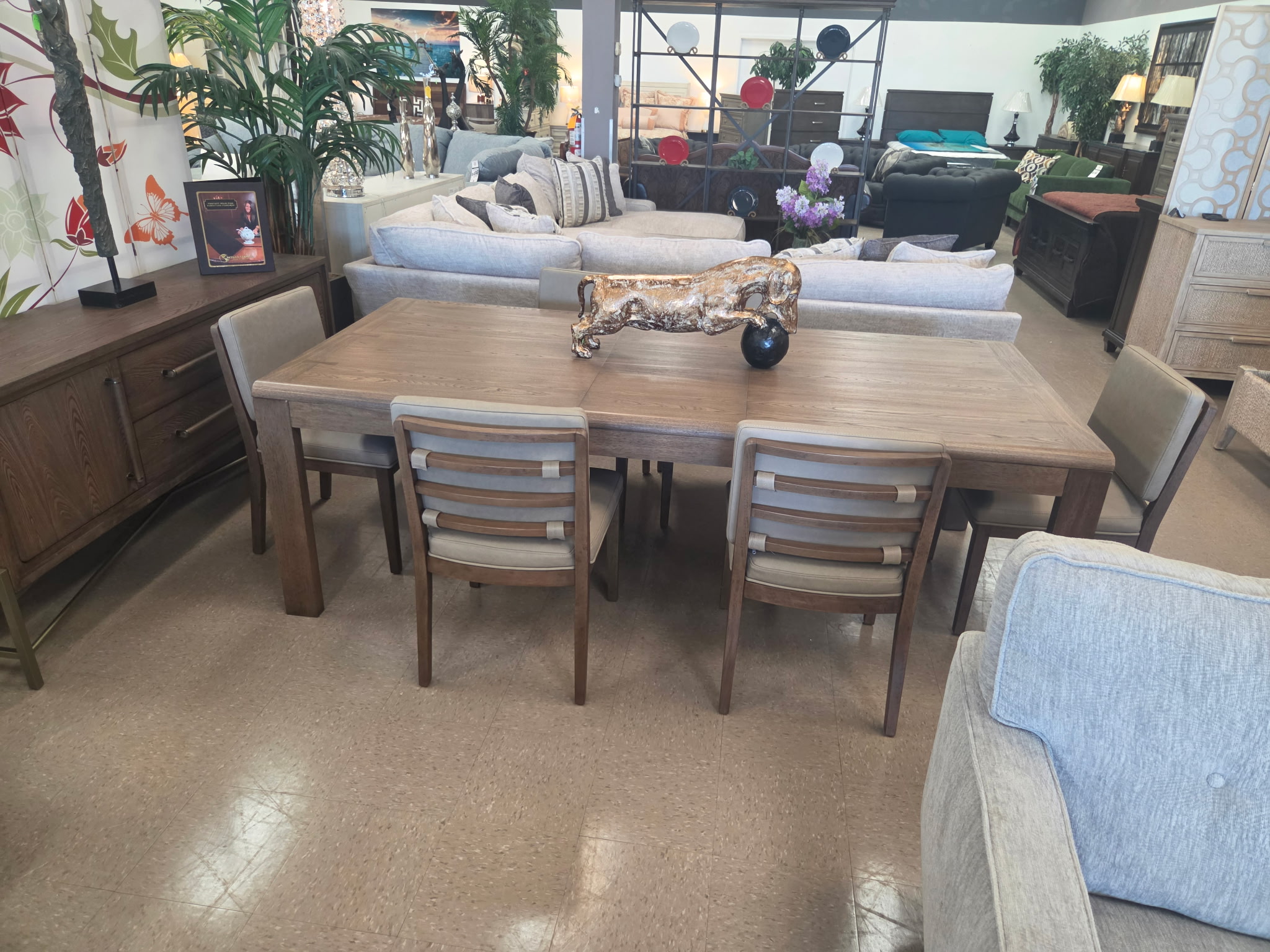 Wood dining set displayed in The Furniture Source showroom