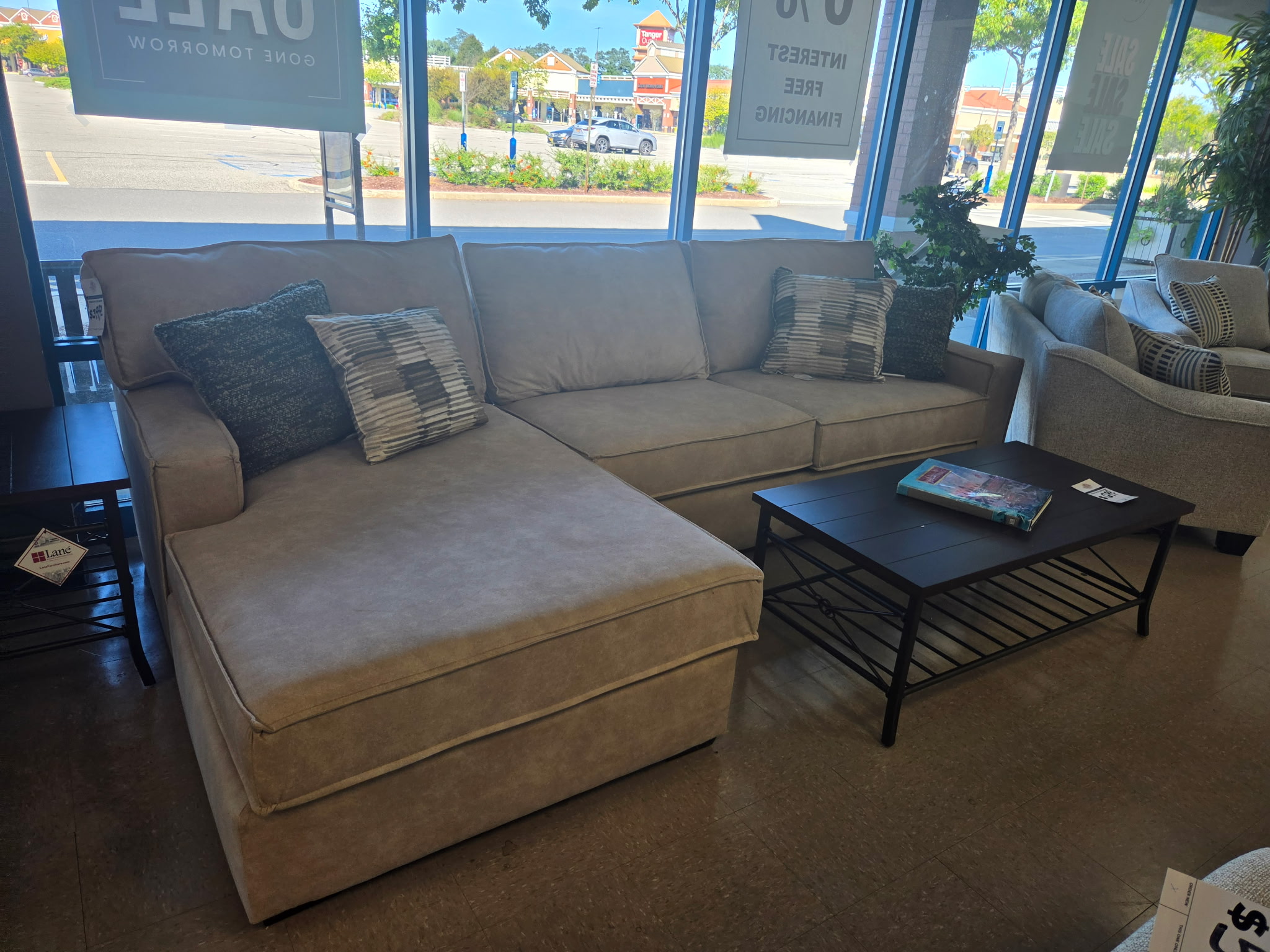 Neutral sectional sofa with chaise in the Riverhead showroom