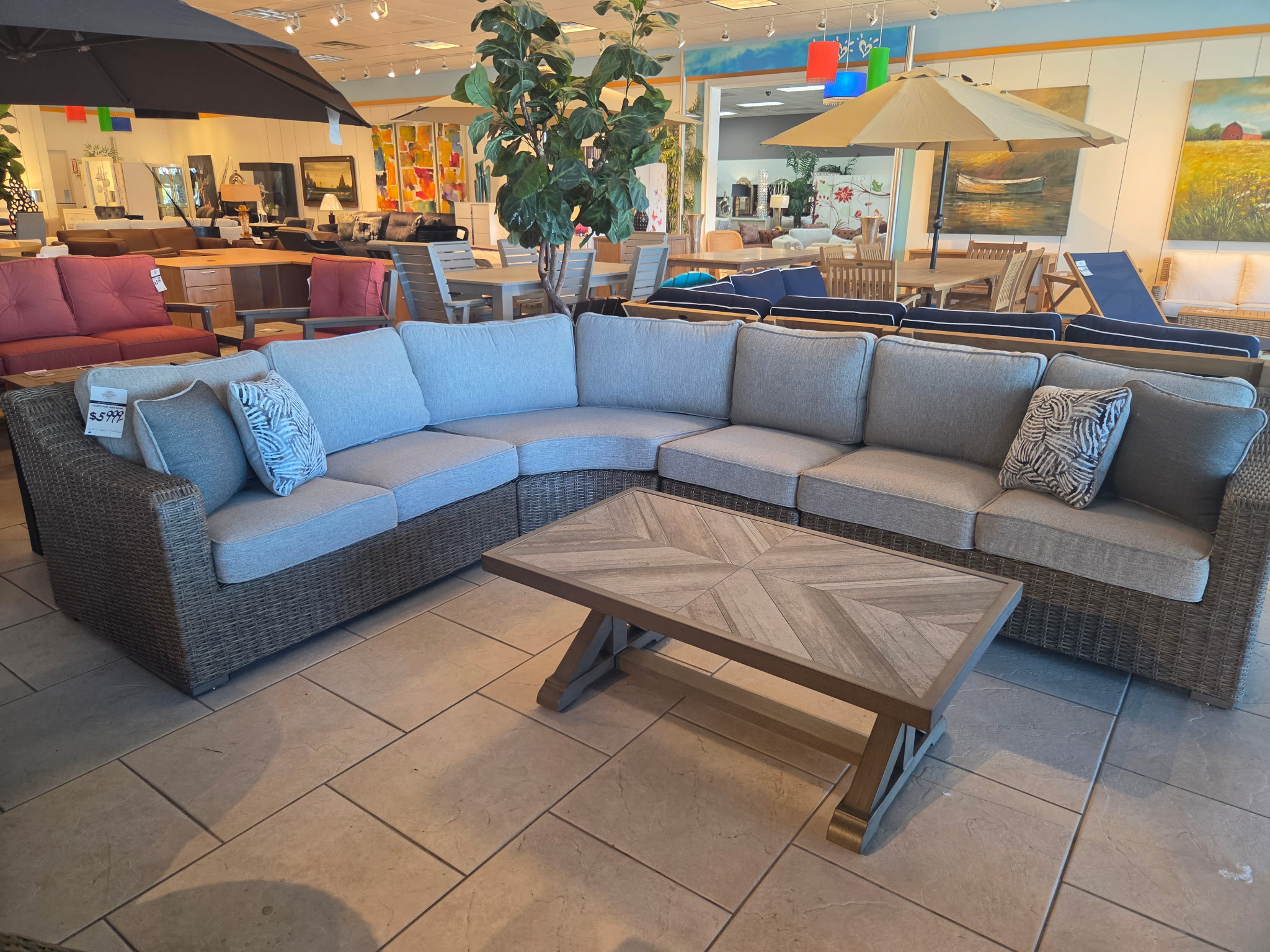 Wicker outdoor sectional with coffee table in the showroom